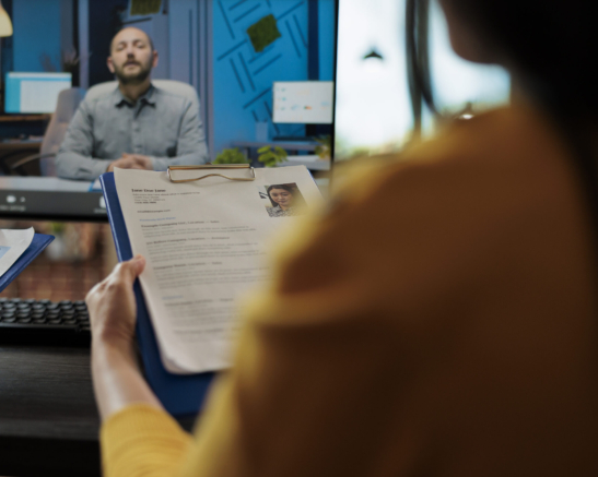 Businesswoman reading freelancer cv discussing hiring offer with remote recruiter during online videocall meeting conference in startup company office. Teleconference call on computer screen