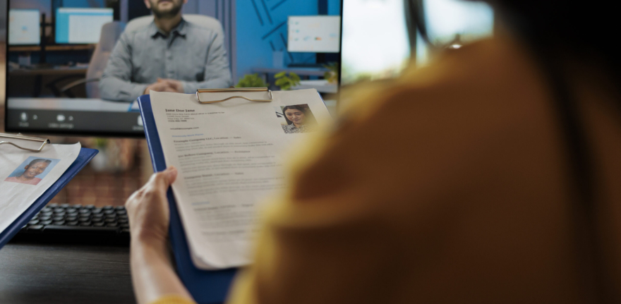 Businesswoman reading freelancer cv discussing hiring offer with remote recruiter during online videocall meeting conference in startup company office. Teleconference call on computer screen
